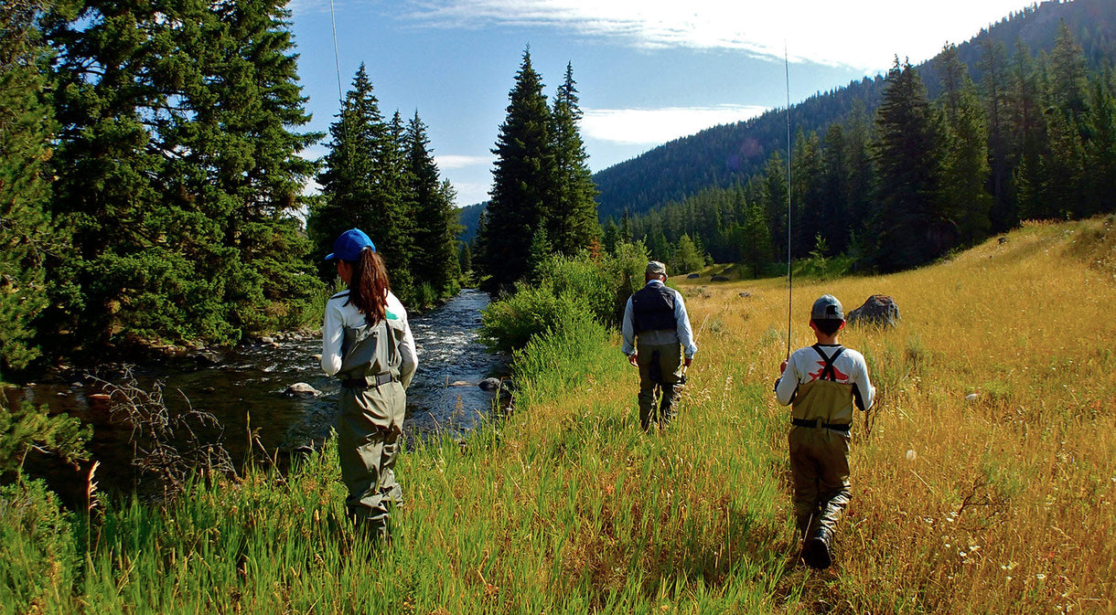 Yvon and the kids head upstream to dip their toes into Montana trout water and soak up the dry, high-elevation scenery. Photo: Dylan Tomine