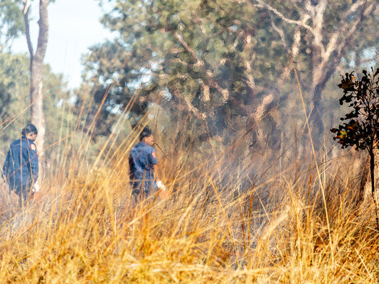 Mimal Rangers Kaitlin John, left, and Josephine Austral, right, head out on Country to begin their dry season burning for the day. Photo: Renae Saxby